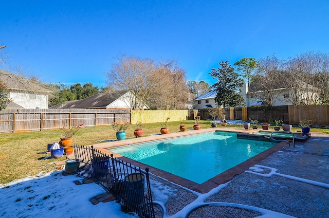 view of swimming pool featuring a patio and a lawn