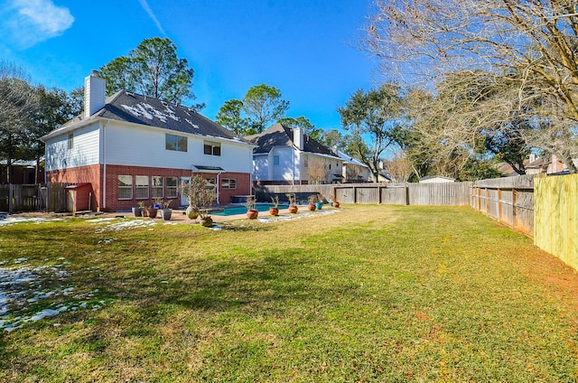 view of yard featuring a swimming pool and a patio area