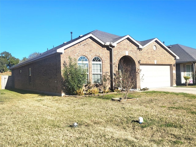 view of front of home with a garage and a front yard