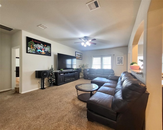 living room with carpet and ceiling fan