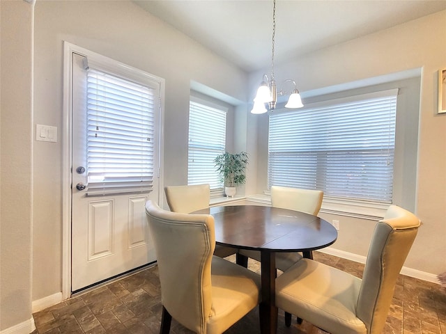 dining area featuring an inviting chandelier