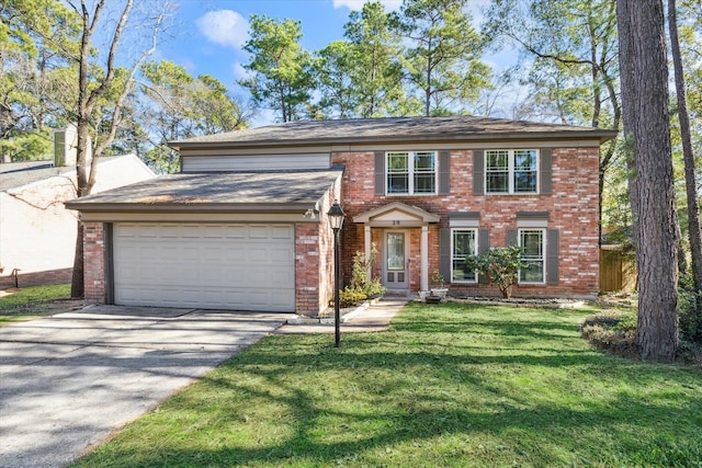 colonial-style house featuring a garage and a front lawn