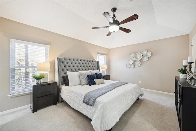 carpeted bedroom featuring lofted ceiling and ceiling fan