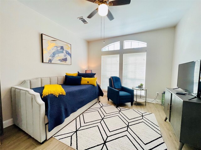 bedroom featuring ceiling fan and light hardwood / wood-style floors