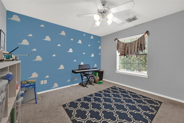 game room with ceiling fan and carpet flooring