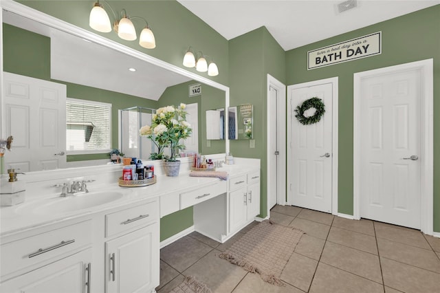 bathroom featuring tile patterned flooring and vanity