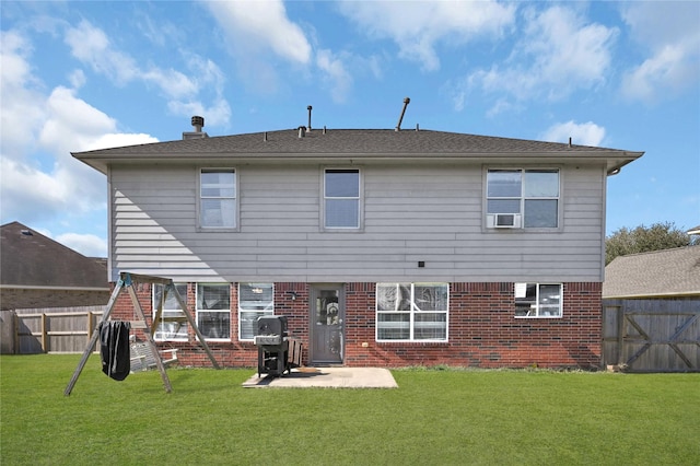 rear view of house with a patio, cooling unit, and a lawn