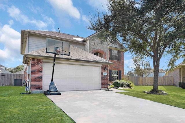 front of property with a garage, central AC, and a front lawn