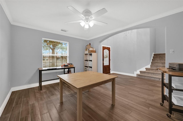 office space featuring crown molding, ceiling fan, and dark hardwood / wood-style flooring