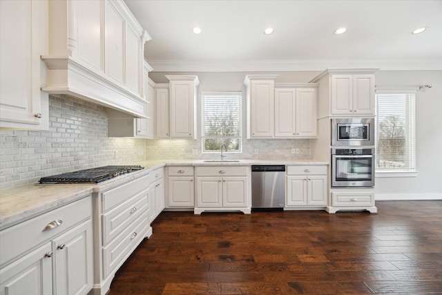 kitchen featuring white cabinetry, stainless steel appliances, dark wood-type flooring, and sink