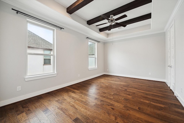 empty room featuring beamed ceiling, dark hardwood / wood-style floors, ceiling fan, and a tray ceiling