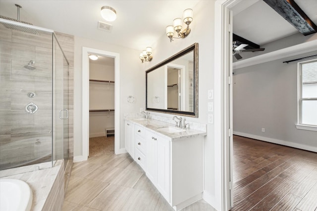 bathroom with ceiling fan, vanity, separate shower and tub, and wood-type flooring