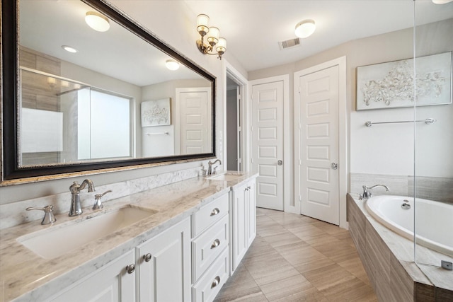 bathroom with vanity, tile patterned flooring, and independent shower and bath