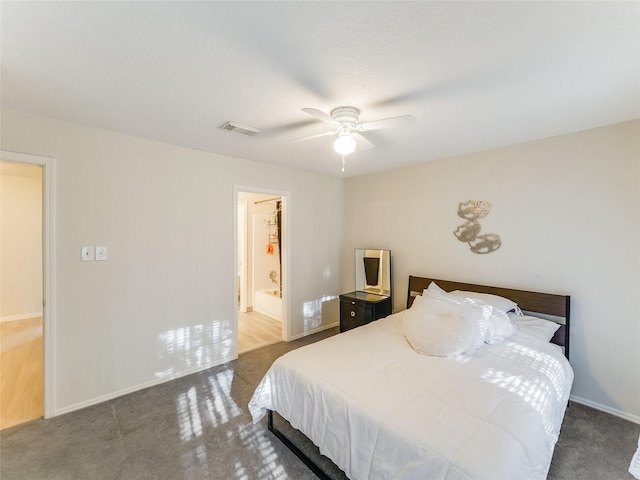 bedroom featuring dark carpet and ceiling fan