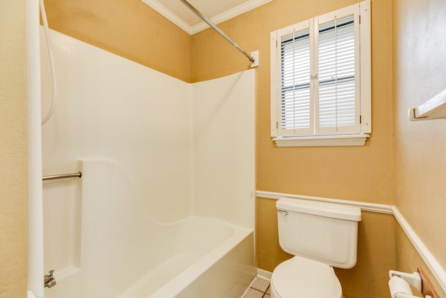 bathroom featuring crown molding, tile patterned floors, and toilet