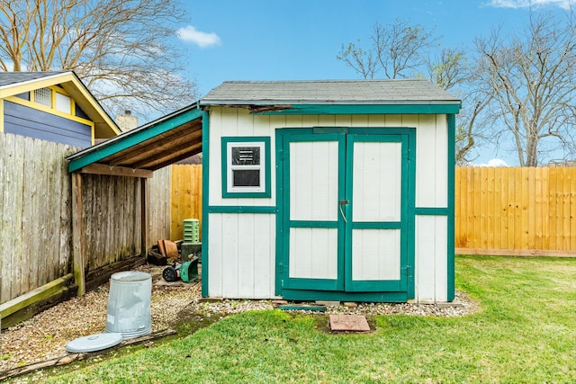 view of outbuilding with a lawn