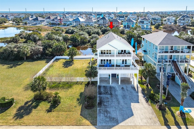 drone / aerial view with a water view