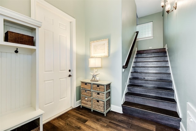 stairway with hardwood / wood-style floors