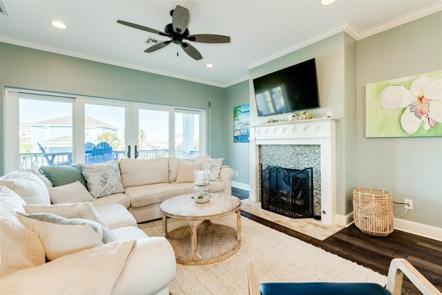 living room with ceiling fan, ornamental molding, and hardwood / wood-style floors