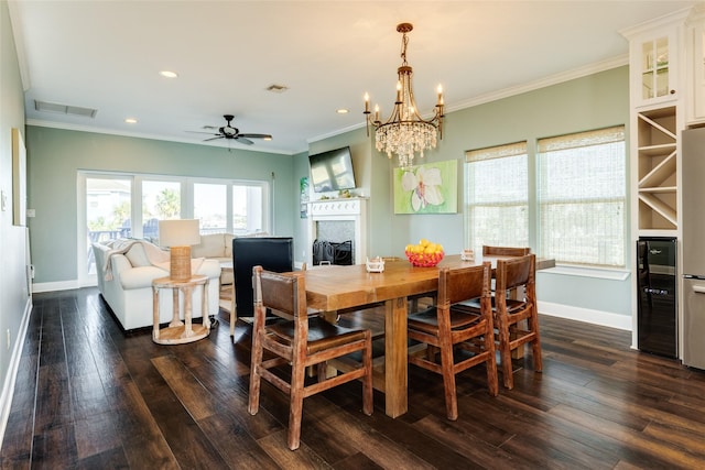 dining area featuring crown molding, ceiling fan, dark hardwood / wood-style flooring, and wine cooler