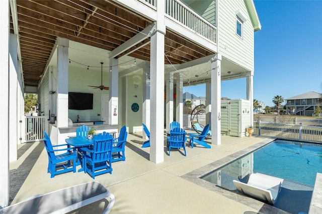 view of swimming pool with a patio area and ceiling fan