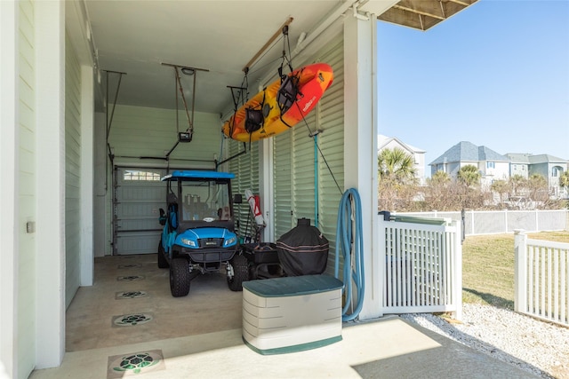 garage featuring a carport and a garage door opener