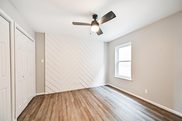 unfurnished bedroom with hardwood / wood-style floors and ceiling fan