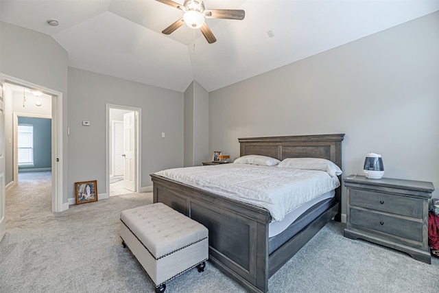 carpeted bedroom featuring vaulted ceiling and ceiling fan