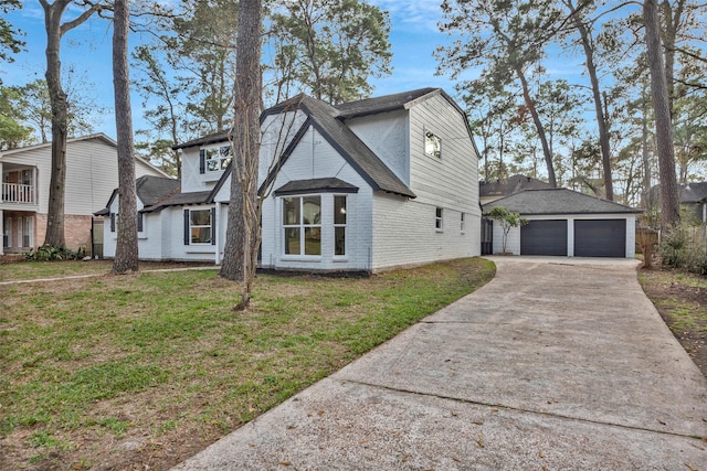 view of front of house with a garage and a front lawn