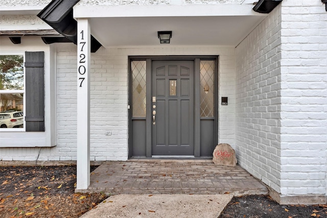 17207 Hill View Ln, Spring, TX 77379 - view of exterior entry featuring brick siding