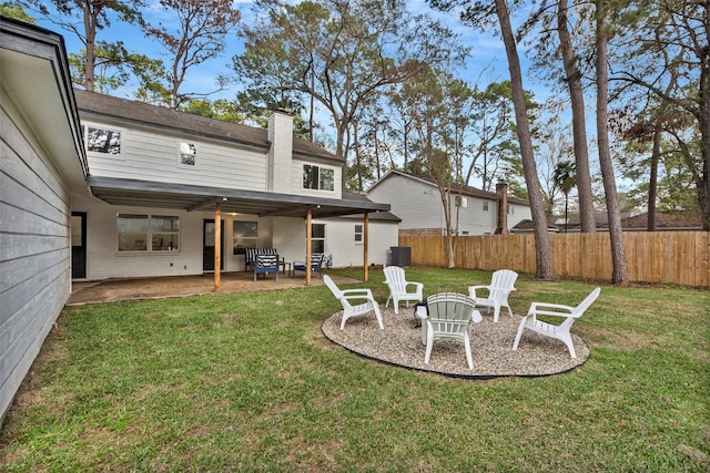 view of yard featuring a fire pit, a patio, and central air condition unit