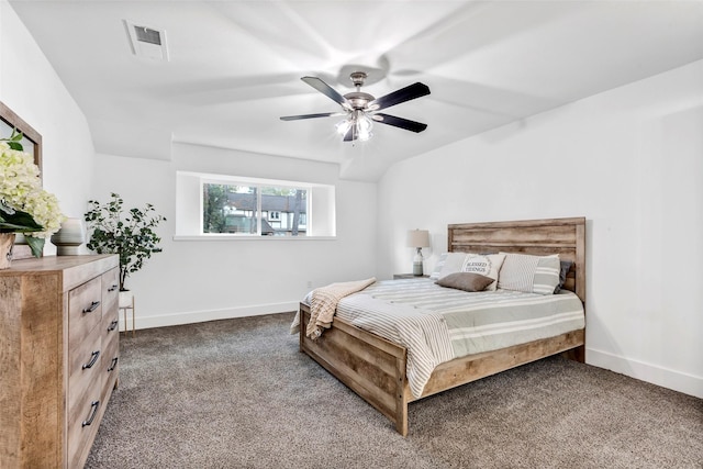 carpeted bedroom with ceiling fan and vaulted ceiling