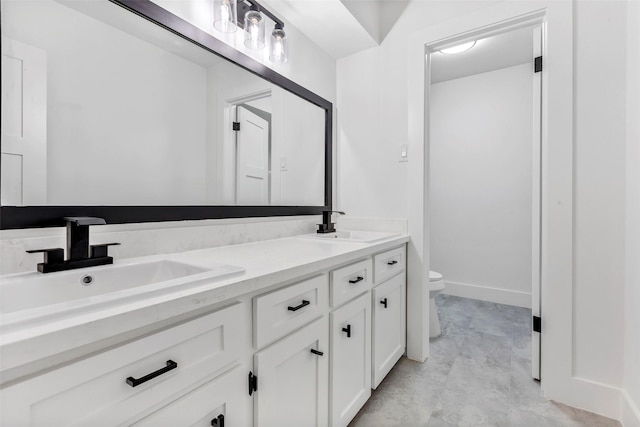 bathroom with vanity and toilet