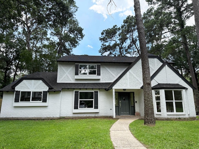 17207 Hill View Ln, Spring, TX 77379 - view of front facade featuring a front lawn, roof with shingles, and brick siding