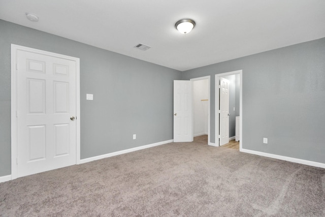 unfurnished bedroom with carpet flooring