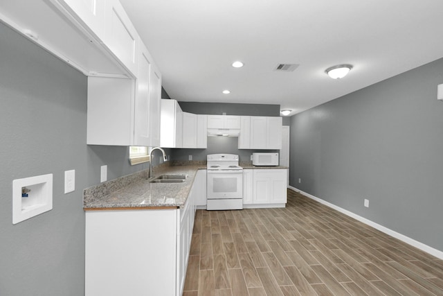 kitchen with sink, white cabinets, light stone countertops, white appliances, and light hardwood / wood-style flooring