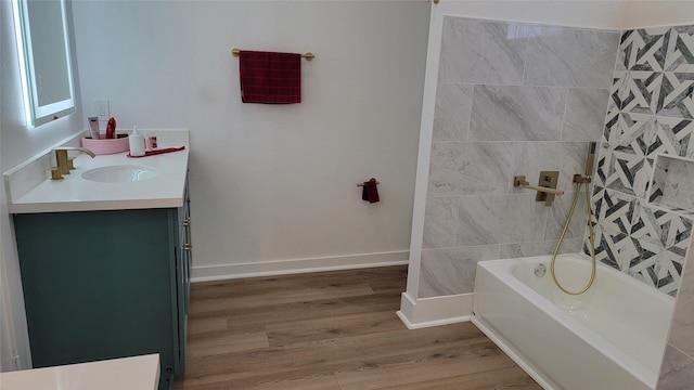 bathroom with vanity, wood-type flooring, and bathtub / shower combination