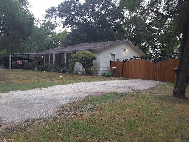 view of side of home featuring a yard