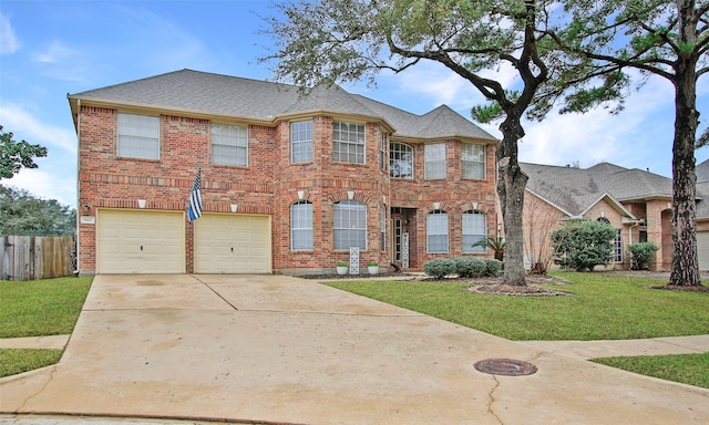 view of front of home featuring a garage and a front lawn