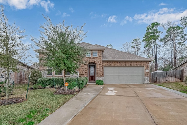 view of front of house with a garage and a front yard