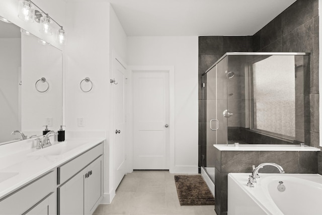 bathroom with vanity, independent shower and bath, and tile patterned flooring