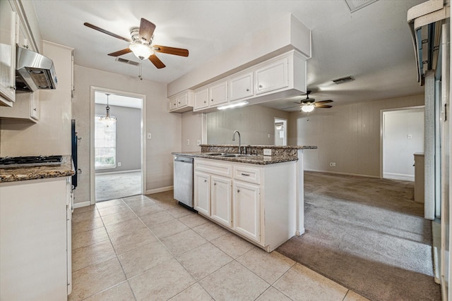 kitchen with light carpet, white cabinetry, and stainless steel appliances