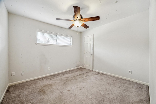 unfurnished room featuring light colored carpet and ceiling fan