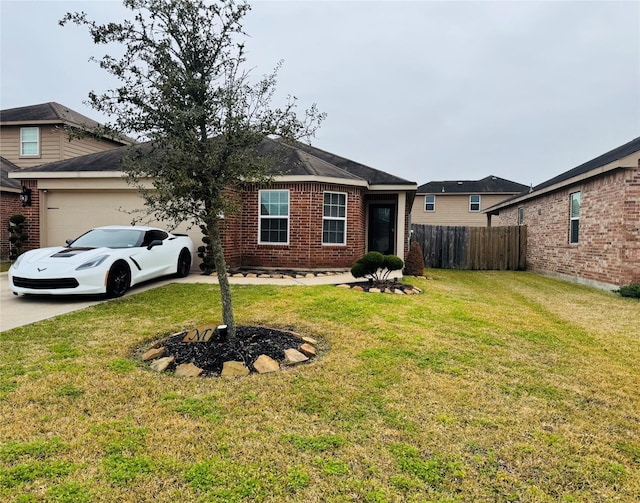 view of front of house with a garage and a front yard