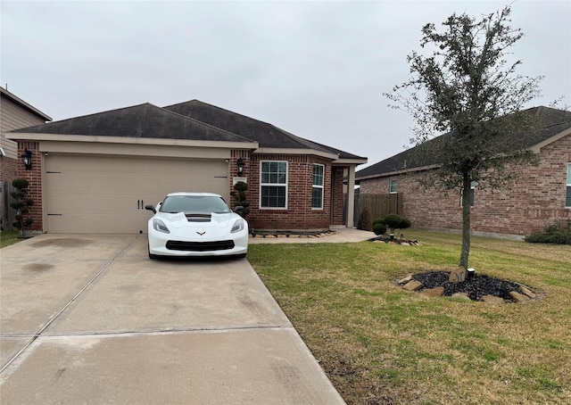 view of front of home with a garage and a front lawn