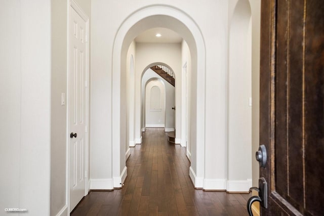 corridor featuring dark wood-type flooring