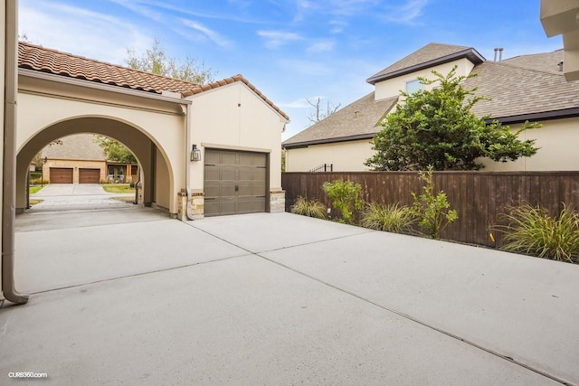 view of property exterior featuring a garage