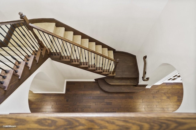 stairs featuring hardwood / wood-style flooring