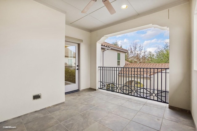 balcony with a patio and ceiling fan