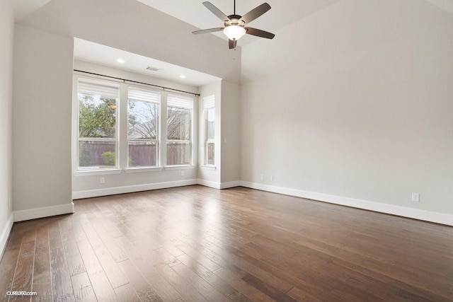 spare room featuring ceiling fan and dark hardwood / wood-style flooring